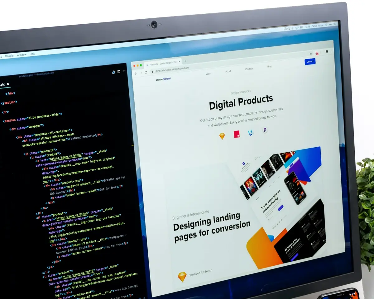 Responsive website design and code on a desktop monitor in a modern workspace